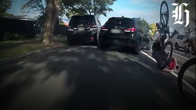 Auckland cyclist spins through air after collision, confronts