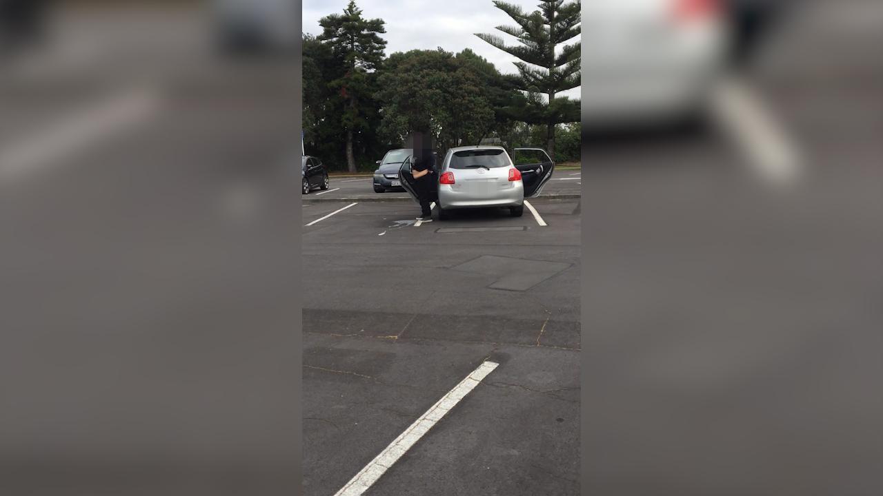 Woman urinates in public carpark in broad daylight