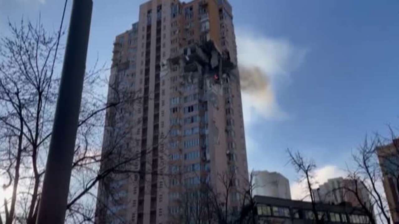 Apartment building in Kyiv under attack, thousands flee Ukraine