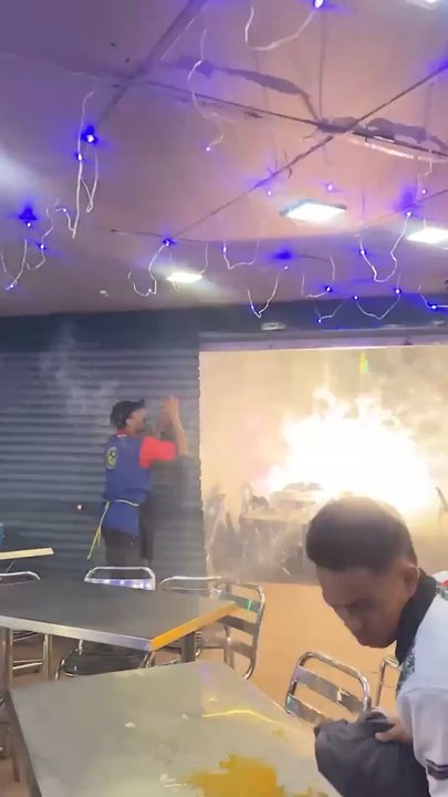 Firework Box Exploding At Table Terrifying moment fireworks stall explodes into restaurant | news.com ...
