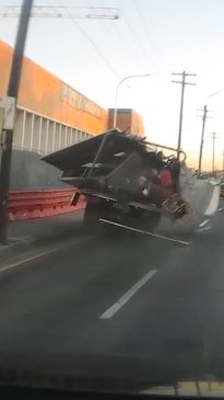 Load fail causes truck to spill across highway | news.com.au ...