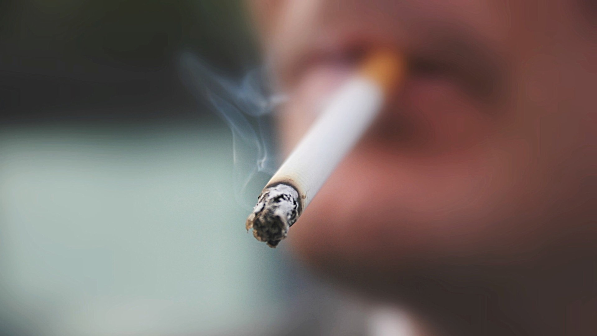 how to light up a cigarette man-lighting-up-a-cigarette