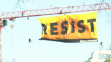9RAW: Greenpeace members scale crane to protest against Trump 