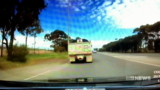 Dashcam captures moment truck was forced to swerve off road