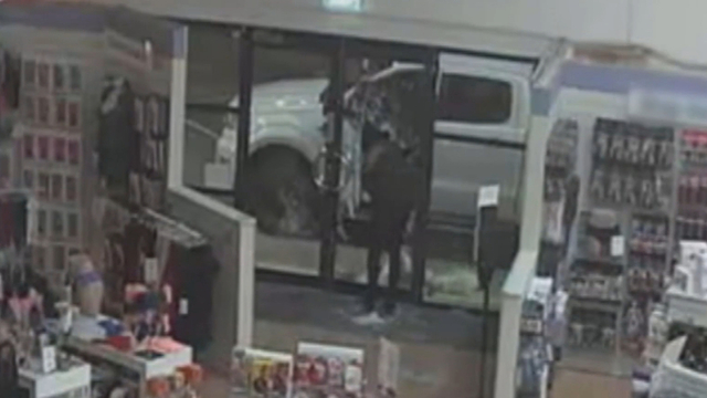 Raunchy raid: Duo steal Kitty the sex doll from Melbourne adult store